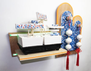 Kwok-pong “Bobby” Tso, “In-between (Where neon still glow),” 2022; ceramic with underglazes, decals, LEDs, wood, metals, and rubbers; 15 3/8 x 22 x 7 in. Courtesy of the artist.